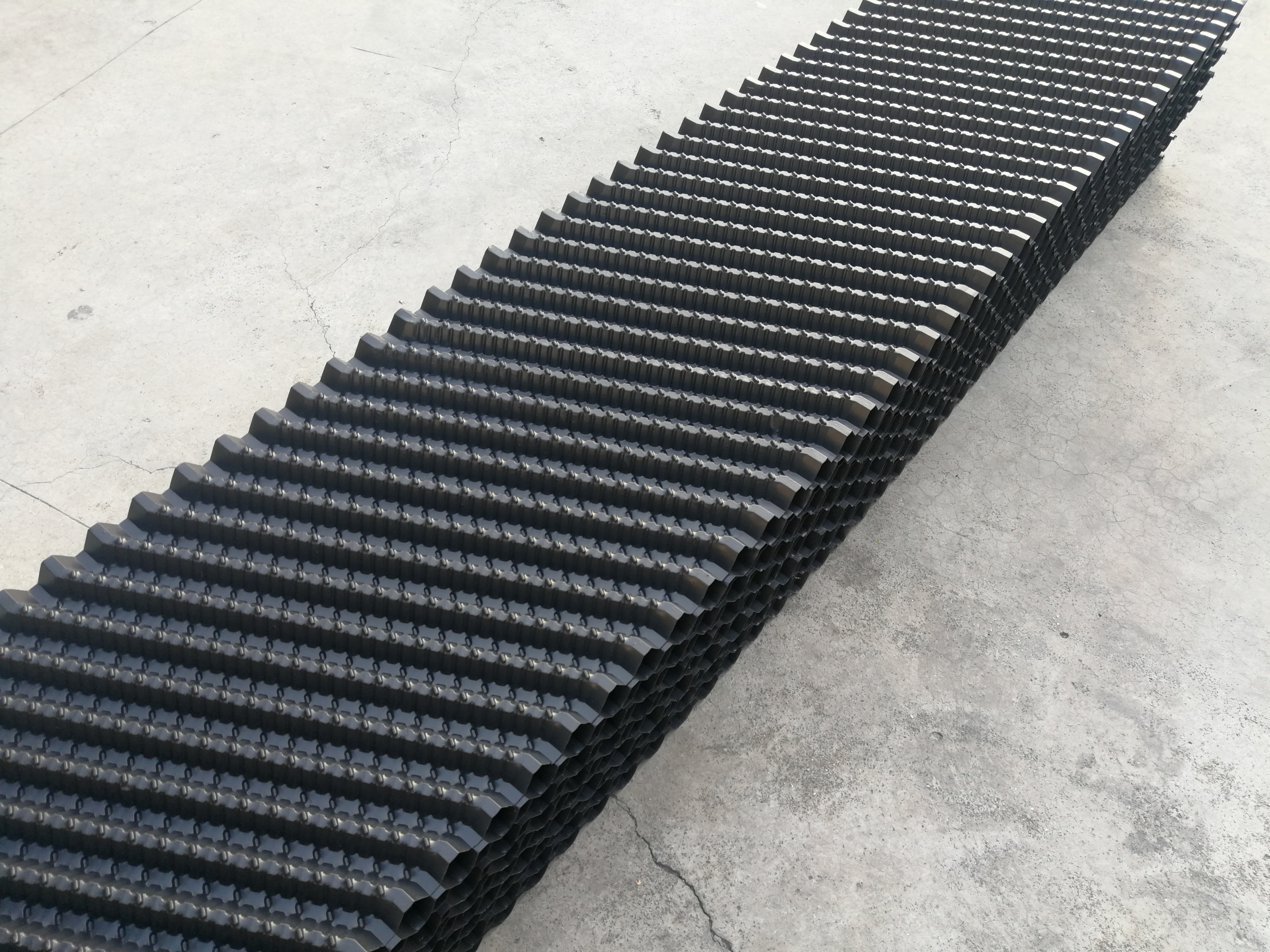 Why do high-quality cooling tower fills have a longer service life?